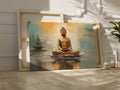 Framed canvas print of a serene Buddha in meditation with warm orange and soft blue abstract background