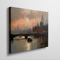 Framed canvas print of London's Westminster and Big Ben at sunset with orange and warm tones reflecting on the Thames River