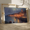 Framed canvas print of a moonlit Mediterranean coastal town with glowing street lamps