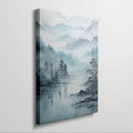 Framed canvas print of a tranquil watercolour landscape with misty blue mountains and serene lake