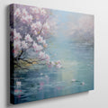 Framed canvas print of a serene landscape with cherry blossoms over tranquil waters