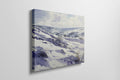 Framed canvas print of a serene winter landscape with snow-covered hills and valleys