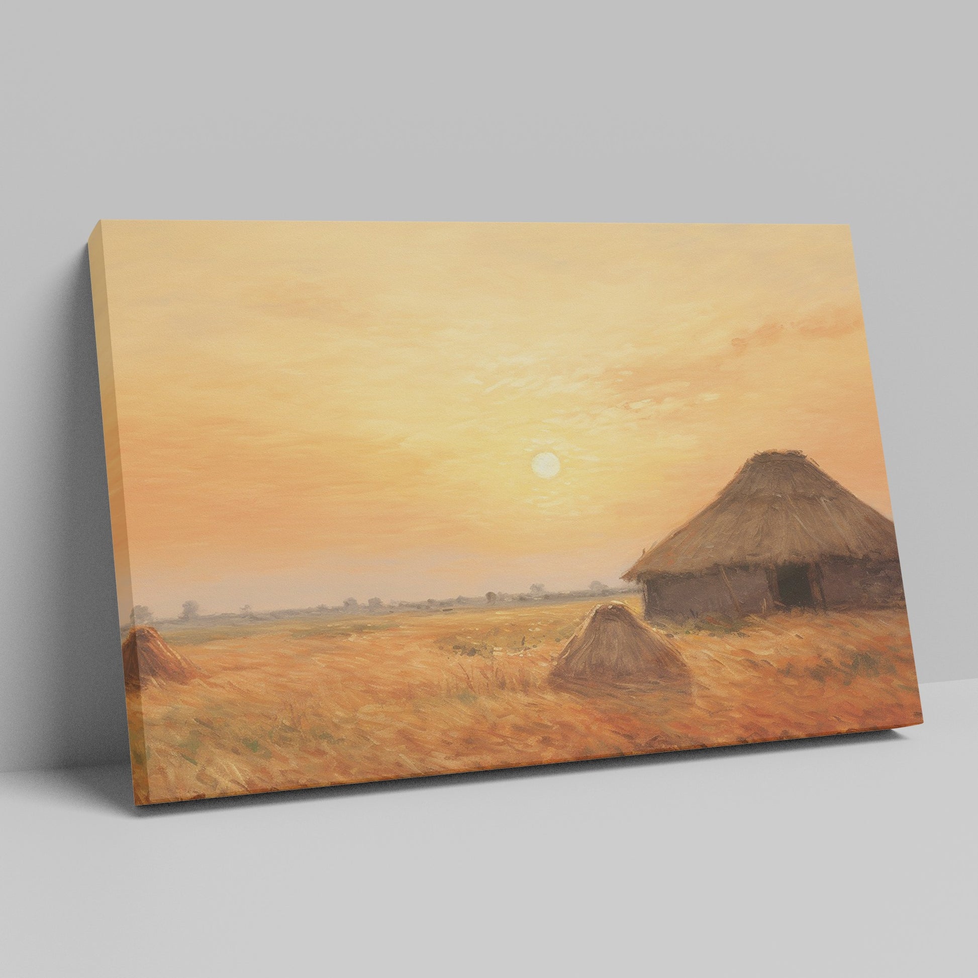 Framed canvas print of a rustic thatched cottage in a countryside landscape at sunset with warm golden and orange hues