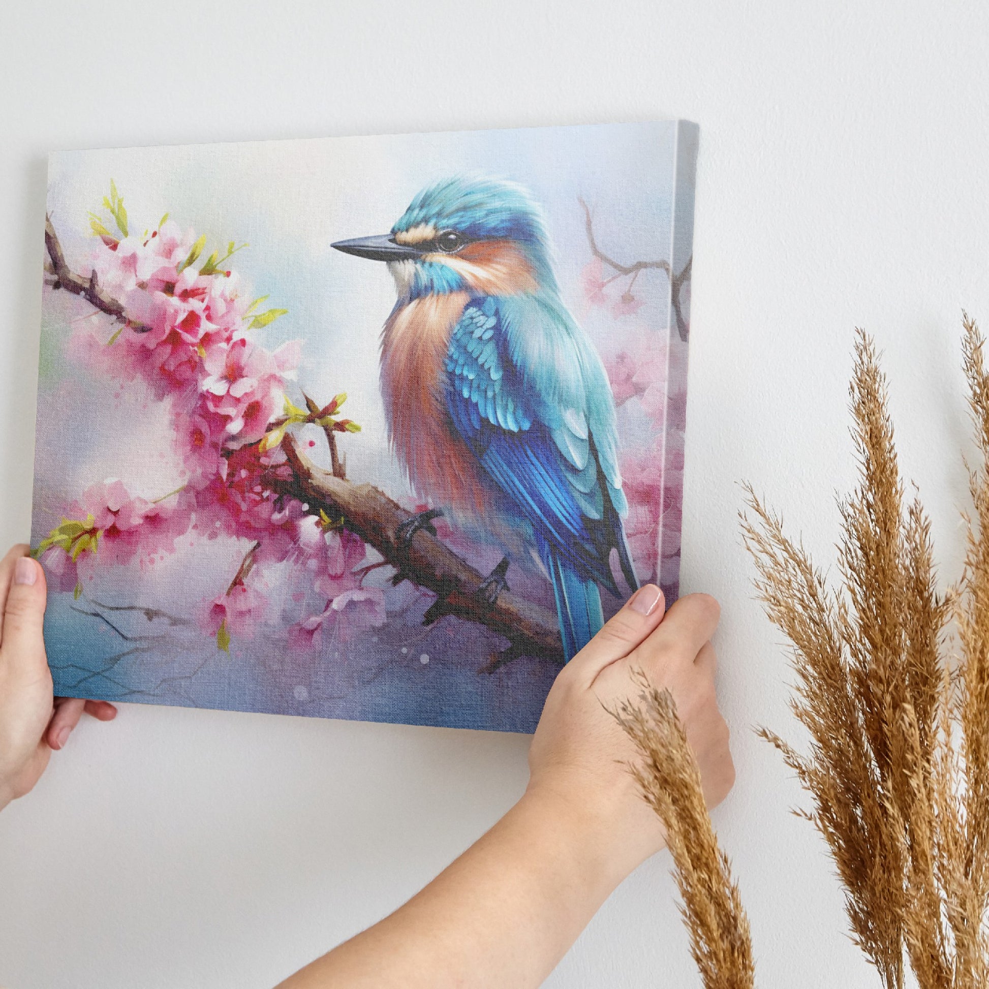 Framed canvas print of a vibrant kingfisher on a flowering cherry blossom branch