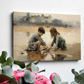 Framed canvas print of two children playing by the shore with a castle in the background