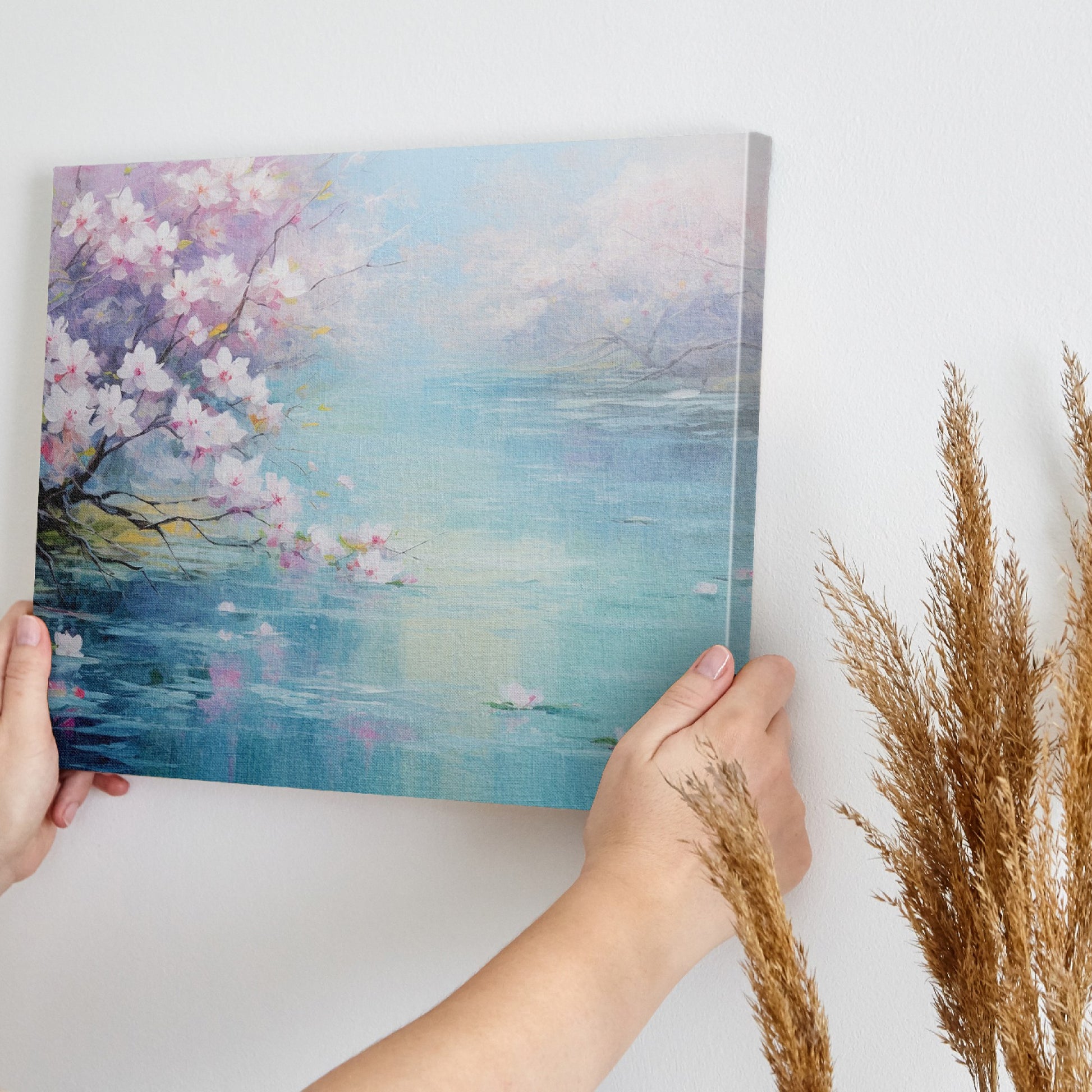 Framed canvas print of a serene landscape with cherry blossoms over tranquil waters