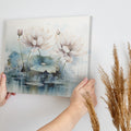 Framed canvas print of watercolour lotus flowers with pastel pink and blue tones