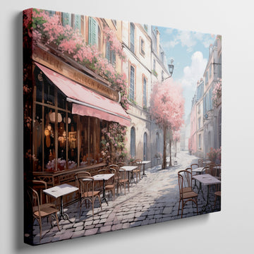 Framed canvas print of a picturesque Parisian alley with cherry blossoms and a street cafe scene in springtime