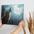 Framed canvas print of a majestic wolf howling in a mystical forest with striking blue and black tones