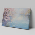 Framed canvas print of a serene impressionist painting with cherry blossoms and river reflections