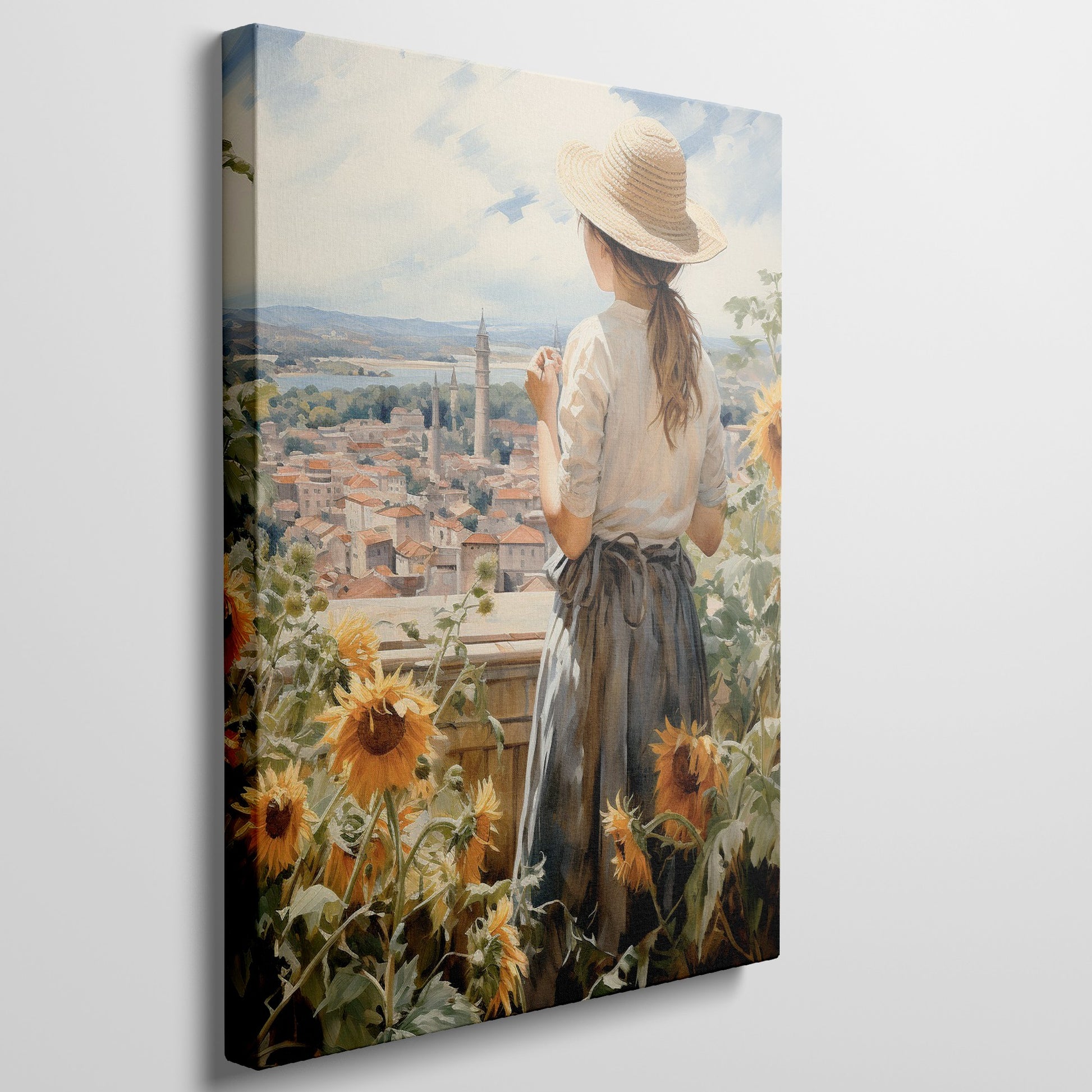 Framed canvas print of a woman gazing over a sunflower field and vintage town