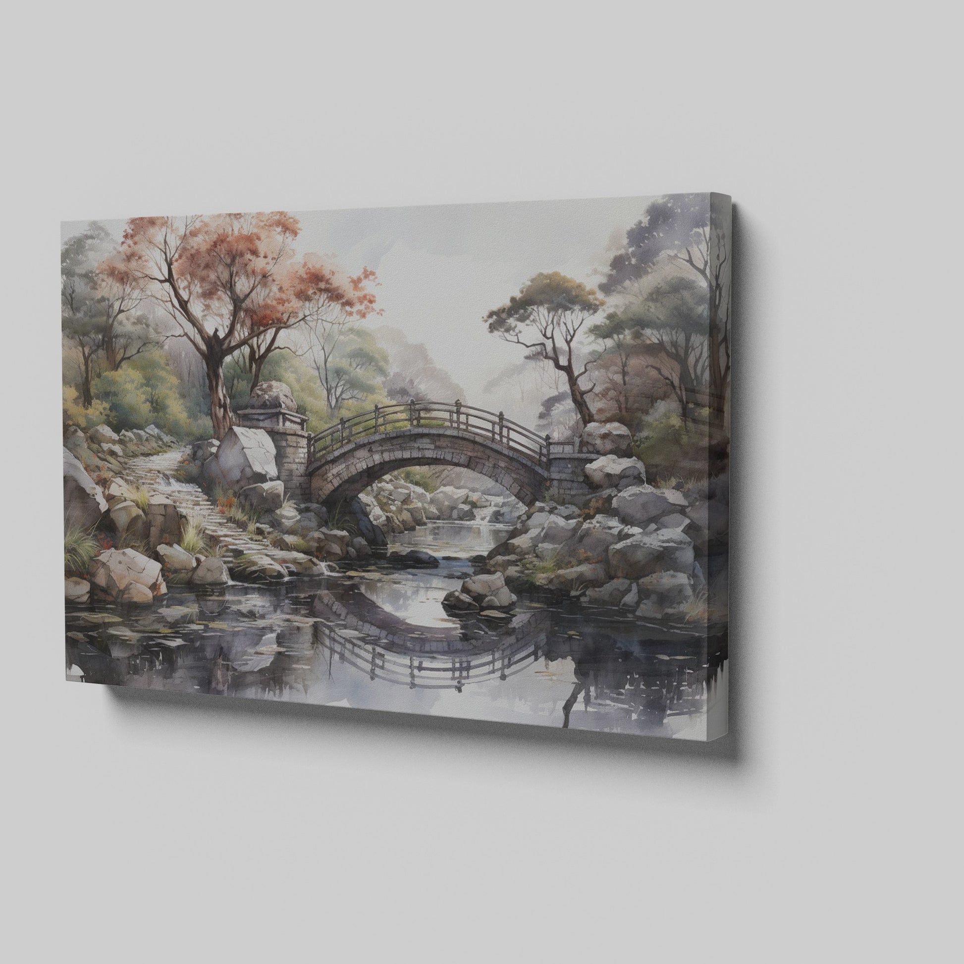 Framed canvas print of an autumnal stone bridge over a serene stream, surrounded by trees with watercolour details