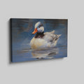 Framed canvas print of an impressionistic painting of a duck on water with blue tones