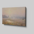 Framed canvas print of a misty countryside meadow with a sunrise and soft pastel colours