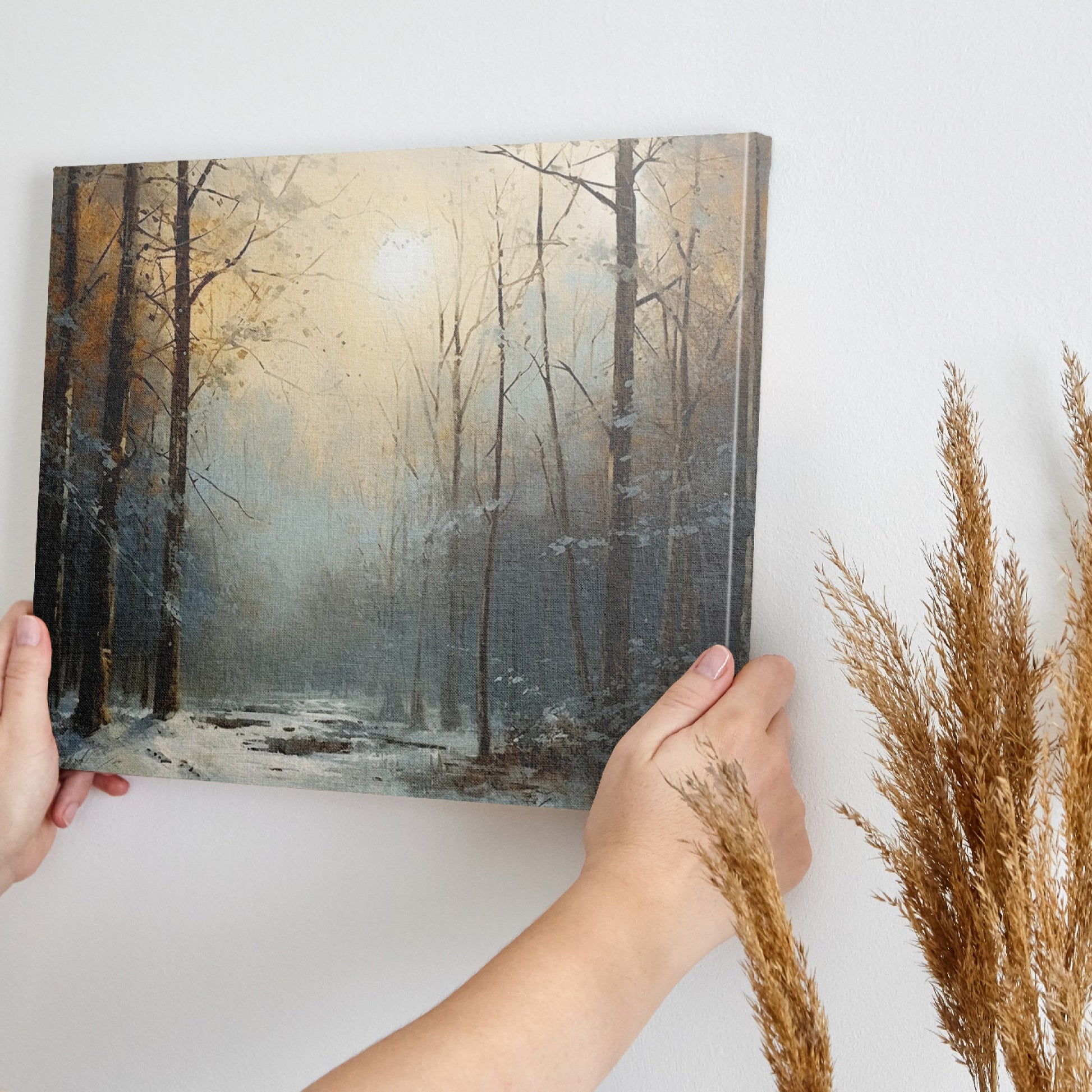 Framed canvas print of a tranquil snowy forest glade with soft dawn light filtering through the trees