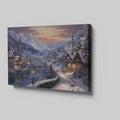 Framed canvas print of a snowy Alpine village at twilight with warm glowing cottages and snow-capped mountains