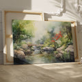 Framed canvas print of a serene Japanese garden with a bridge, waterfall, and flowers