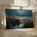 Framed canvas print of an impressionistic landscape with moonlit waters and reed-filled foreground