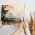 Framed canvas print of traditional Chinese ink wash painting with figures in orange robes and pagodas