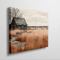 Framed canvas print of a rustic barn in autumn with golden fields and a stone pathway