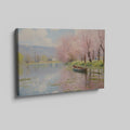 Framed canvas print of a tranquil river landscape featuring blooming cherry blossoms and a boat, in Impressionist style