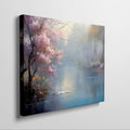 Framed canvas print of a serene landscape with cherry blossoms and a misty lake