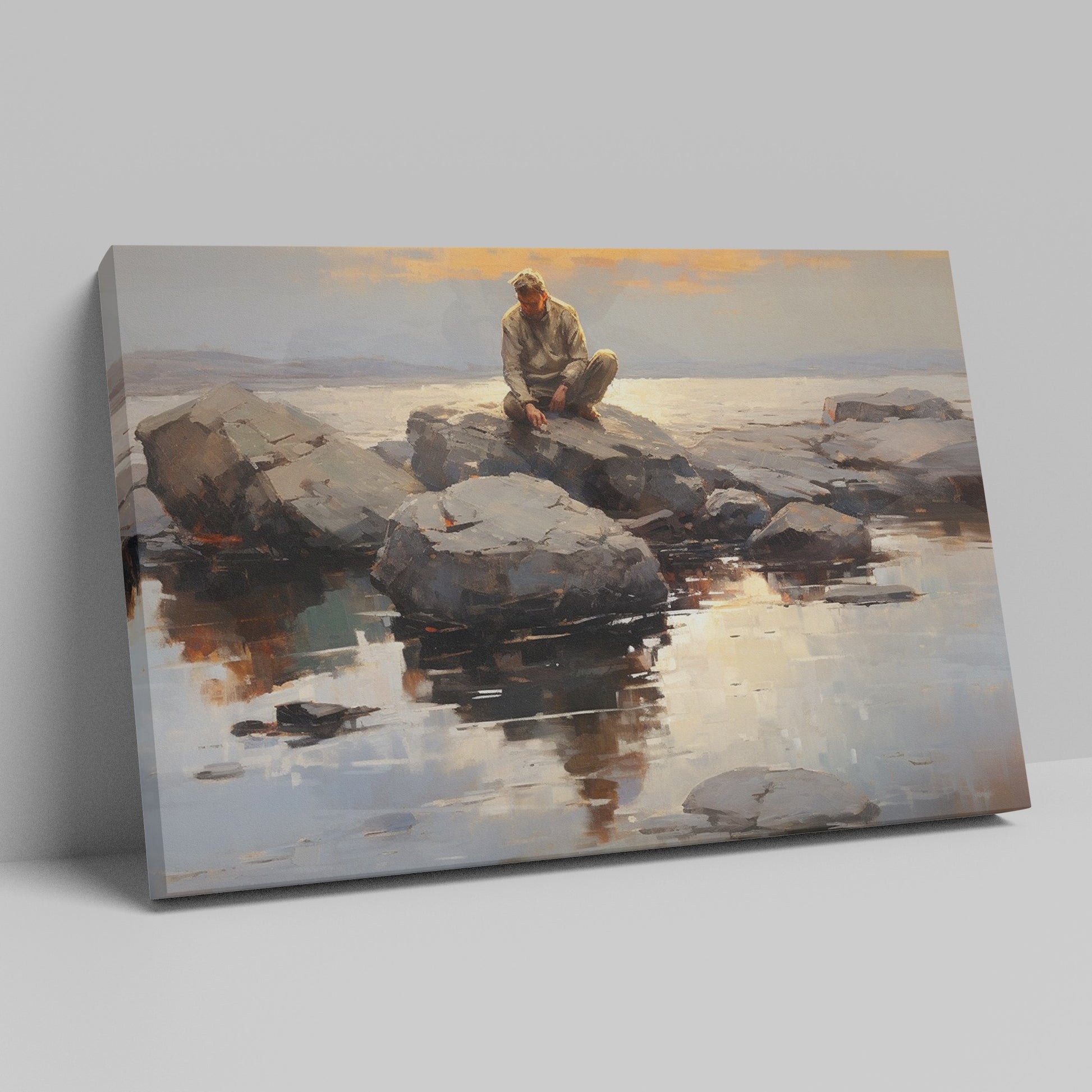 Framed canvas print of serene seascape with man sitting on rocks at sunset