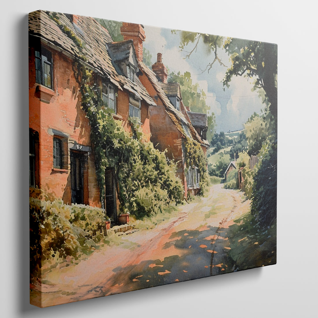 Framed canvas print of English cottage and countryside watercolour scene with lush greenery