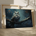 Framed canvas print of a mystical owl with amber eyes perched on a branch against a dark, moody background with autumn leaves