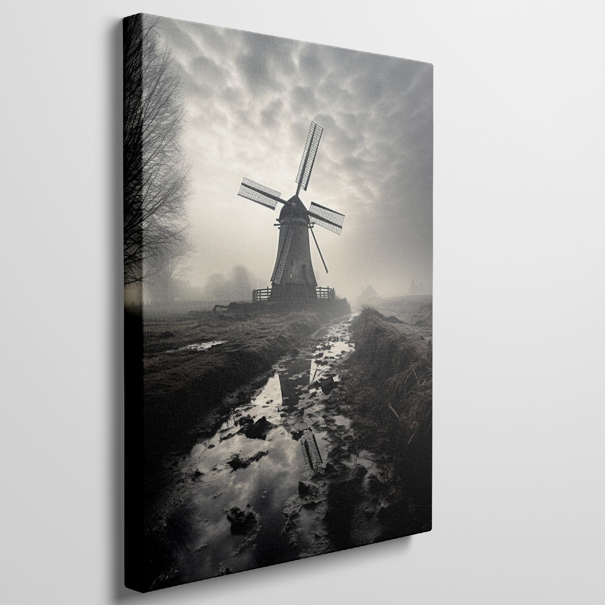 Framed canvas print of a misty Dutch windmill landscape with dramatic sky and reflection in puddle