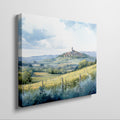 Framed canvas print of a Tuscan landscape with watercolor rolling hills and a village