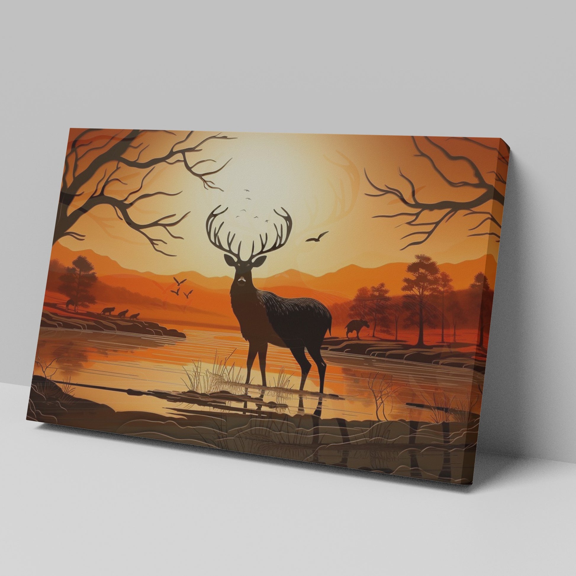 Printed canvas art of a black deer silhouette against an orange sunset with trees and mountains