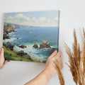 Framed canvas print of a stunning coastal cliff landscape with blue ocean and sunny skies