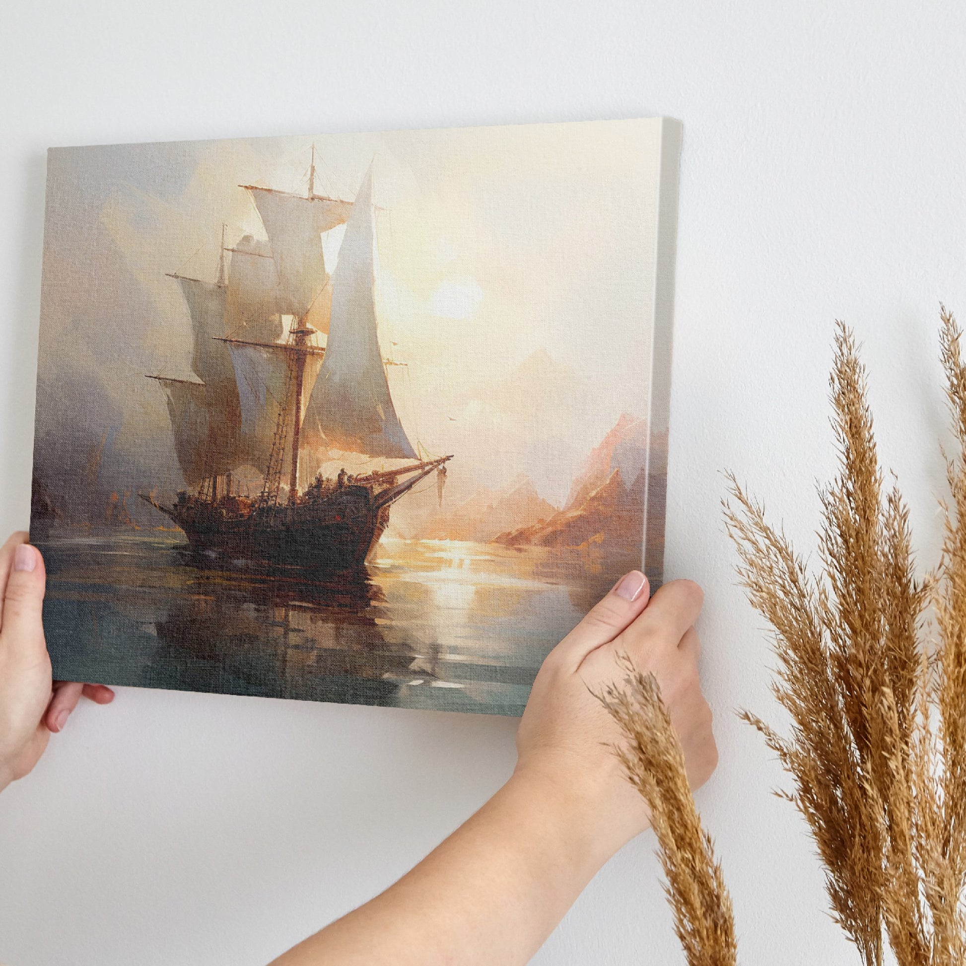 Framed canvas print of a historic sailboat sailing at sunset with golden light reflecting on the water