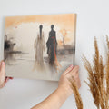 Framed canvas print of silhouette figures in traditional Asian attire with warm sunset backdrop in watercolor style