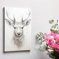 Framed canvas print of a monochrome stag with a unique dripping paint effect