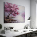 Framed canvas print of an impressionistic cherry blossom tree by a tranquil lake with soft pastel colors