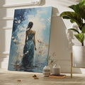 Framed canvas print of a woman in a teal dress with abstract floral background