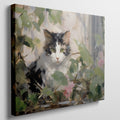 Framed canvas print of impressionist painting featuring a cat with roses and green leaves