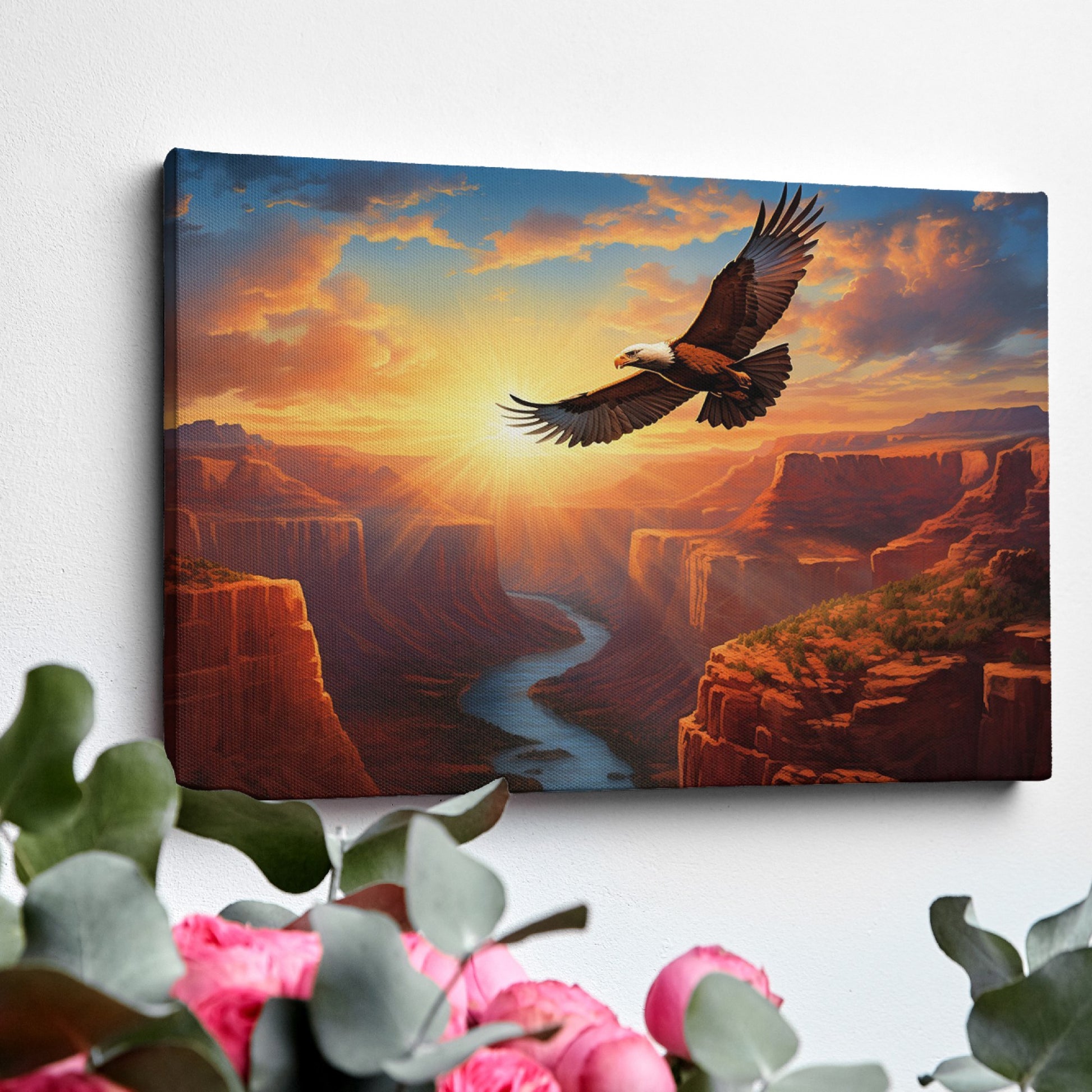 Framed canvas print of a majestic eagle flying over a sunset-lit river canyon