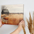 Framed canvas print of a rustic barn in autumn with golden fields and a stone pathway