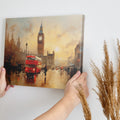 Framed canvas print of an impressionistic London cityscape featuring Big Ben and a red double-decker bus at sunset