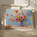 Framed canvas print of textured impasto poppies in a purple vase against a blue background