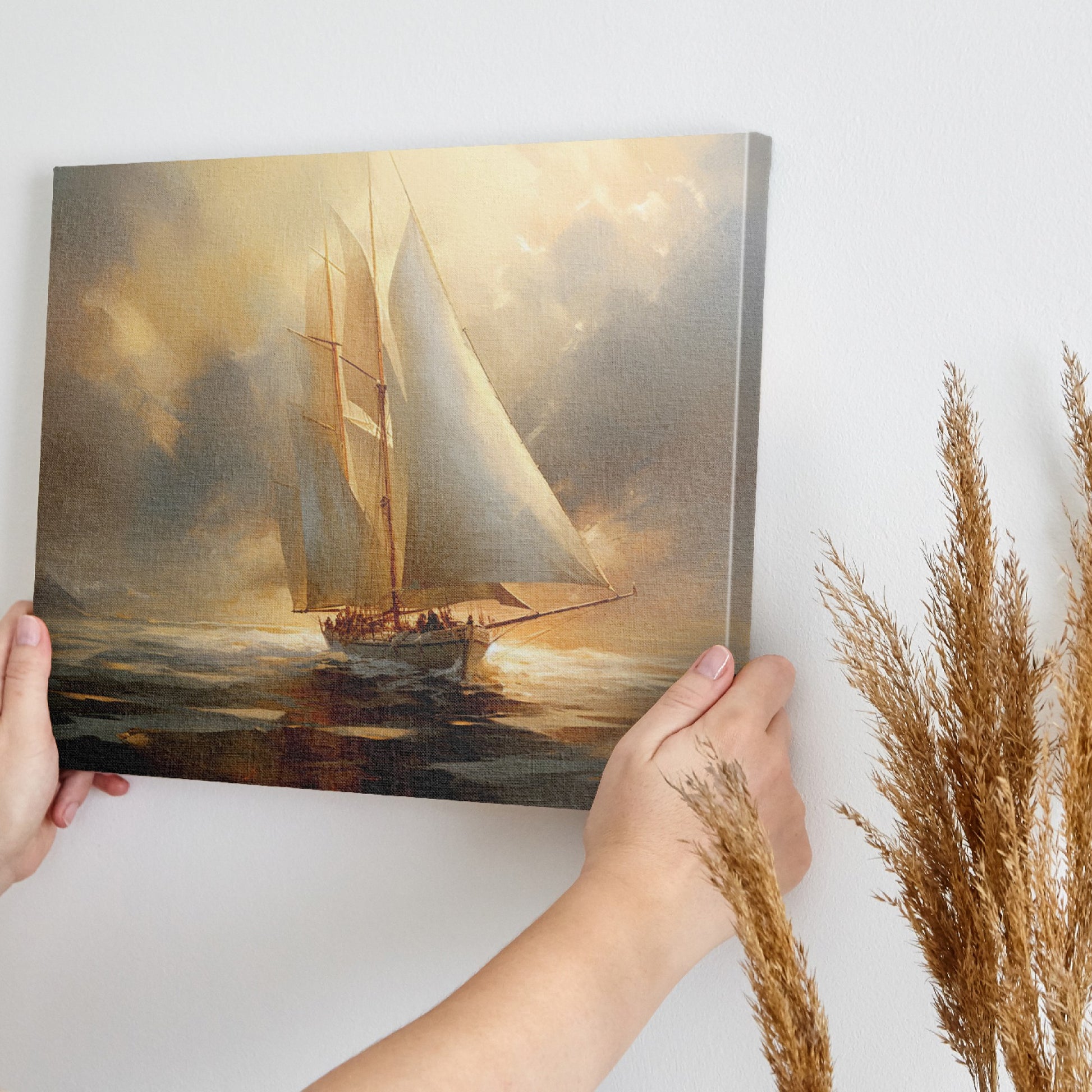 Framed canvas print of a classic sailing ship gliding through the ocean at sunset, with warm golden and amber tones in the sky