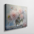 Framed canvas print of delicate dahlias in a glass vase with a soft pastel palette