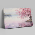 Framed canvas print of a serene cherry blossom tree by a quiet lake with pink and purple reflections