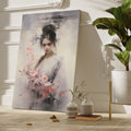 Framed canvas print of an elegant figure with cherry blossoms in soft pastel tones