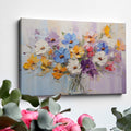 Framed canvas print of vibrant impasto painted flowers in a vase with rich textures and a colourful palette