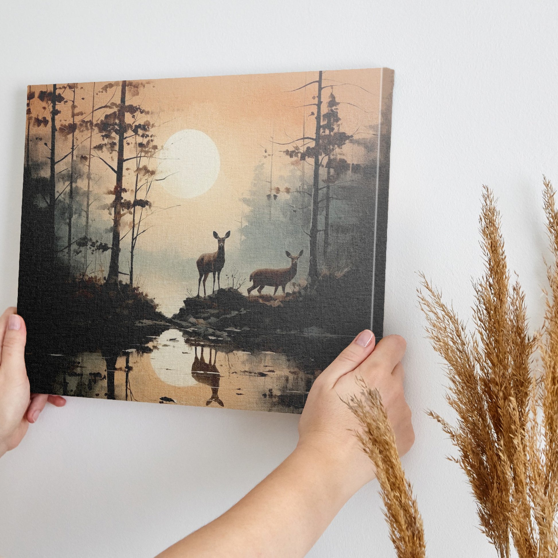 Framed canvas print of serene forest scenery with deer and sunset