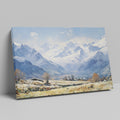 Framed canvas print of an impressionist painting featuring a snowy mountain landscape with an alpine village